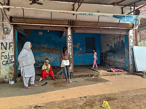 Locals outside an empty shop after public works department (PWD) pasted notices on the properties of several people asking them to remove any illegal construction and warning of action, in violence-hit Maharajganj area of Bahraich, UP.