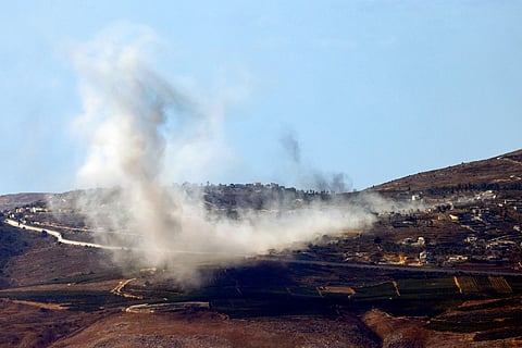 A picture taken from northern Israel along the border with southern Lebanon shows smoke billowing above the Lebanese village of Odaisseh during Israeli bombardment on October 19, 2024.