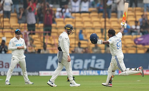 India's Sarfaraz Khan celebrates his century during the fourth day of the first test cricket match between India and New Zealand at M Chinnaswamy Stadium, in Bengaluru, Saturday, Oct 19, 2024.