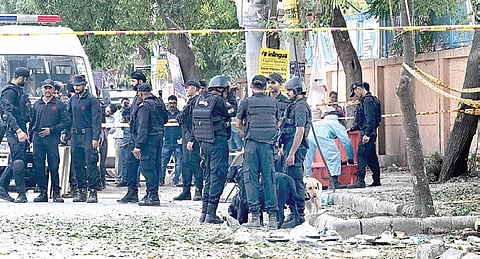 National Security Guard personnel investigate the site after a blast was reported near CRPF school at Prashant Vihar in the Rohini area on Sunday