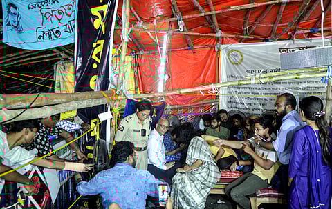 West Bengal Chief Secretary Manoj Pant and Home Secretary Nandini Chakraborty meet junior doctors who are observing fast-unto-death against the RG Kar Medical College and Hospital Rape and murder case, in Kolkata on Saturday. (