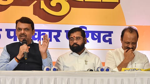 Maharashtra Deputy Chief Minister Devendra Fadnavis addresses a press conference in Mumbai on Oct. 16, 2024. State Chief Minister Eknath Shinde and state Dy CM Ajit Pawar are also present.