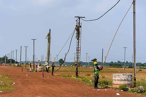 Electricians installing power cables at Baliyatra Ground as part of the preparation for the annual trade fair on November 15 in Cuttack