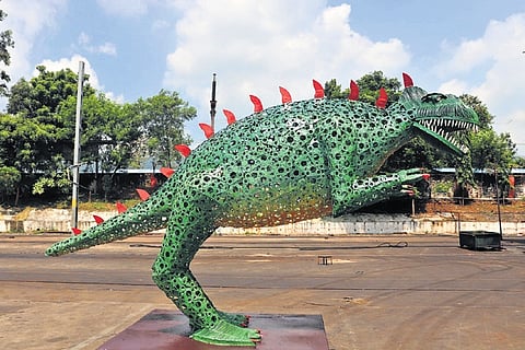A dinosaur installation made of waste materials and scrap