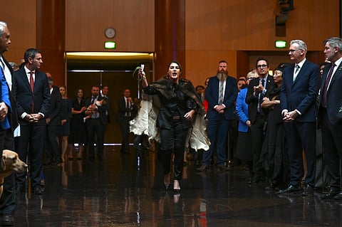 Australian Senator Lidia Thorpe, center, disrupts proceedings as Britain's King Charles III and Queen Camilla attend a Parliamentary reception hosted by Australian Prime Minister Anthony Albanese and partner Jodie Jaydon at Parliament House in Canberra, Australia, Monday, Oct. 21, 2024.