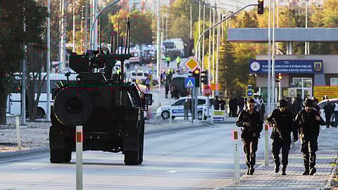Emergency and security teams are deployed outside the Turkish state-run aerospace and defense company Turkish Aerospace Industries Inc. on the outskirts of Ankara, Turkey, Wednesday.