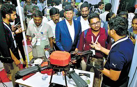 Visitors at a stall at Amaravati drone exhibition on Wednesday