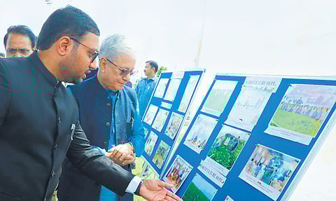 Governor Jishnu Dev Varma observes a photo exhibition at Suryapet on Thursday