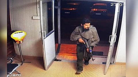 A screen grab of the CCTV footage showing the militant entering a prefabricated hut, believed to be at the Gagangir tunnel construction site.