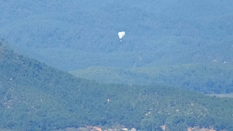 North Korean balloons are seen from the Unification Observation Post in Paju, South Korea, near the border with North Korea, on Oct. 4, 2024.