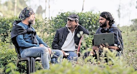 Director Sajeed A (c) with Unni R and another crew member