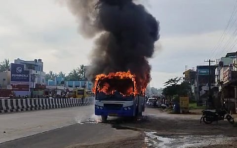 A TNSTC mofussil bus playing between Pollachi and Coimbatore caught fire on the Pollachi - Coimbatore National Highways road near Othakkalmandapam in the city outskirts on Thursday morning.