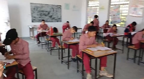 Students writing the exam without teacher's supervision in Tehri.