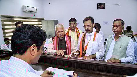 BJP's Harvinder Kalyan (C) files nomination papers in the presence of former Haryana Chief Minister Manohar Lal Khattar during the run-up to the recently concluded Haryana Assembly polls.