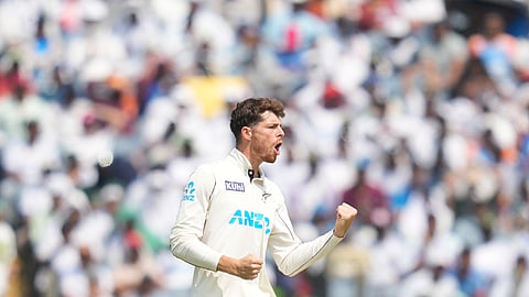 New Zealand's Mitchell Santner celebrates a wicket during the day three of the second cricket test match between India and New Zealand in Pune.