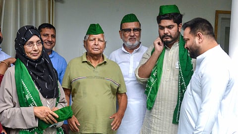 RJD Chief Lalu Prasad Yadav with Leader of Opposition in Bihar Assembly Tejashwi Yadav, former MP Mohammad Shahabuddin's wife Hina Sahab, and son Osama Sahab at a party-joining event, in Patna, Sunday.