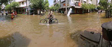 Water overflowing from Pandalkudi channel inundated houses in Sellur Kattabomman Nagar in Madurai on Saturday.