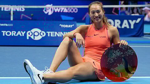 China's Zheng Qinwen poses with her trophy after winning the Pan Pacific Open women's tennis tournament at Ariake Coliseum, in Tokyo, Sunday, Oct. 27, 2024.