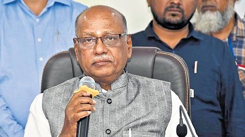 BC Commission chairman G Niranjan addresses the gathering during a public hearing held at Adilabad Zilla Parishad meeting hall on Monday.