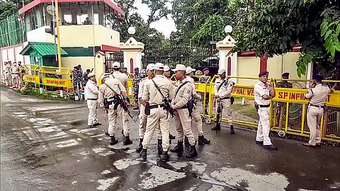 Security personnel stand guard outside the Raj Bhavan in Imphal West, Manipur.