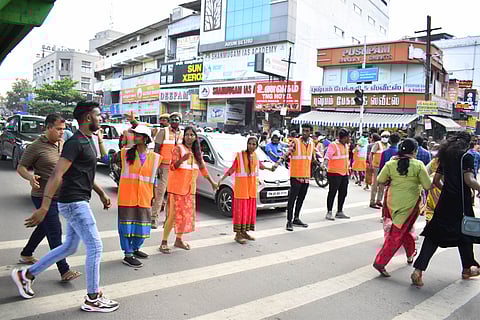 Students from different colleges across Coimbatore city have been roped into regulating the traffic at Gandhipuram in Coimbatore on Sunday. As the traffic is high due to the festival session.