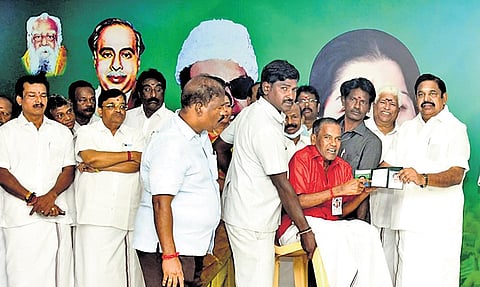 AIADMK general secretary Edappadi K Palaniswami distributing assistance at the party headquarters on Tuesday
