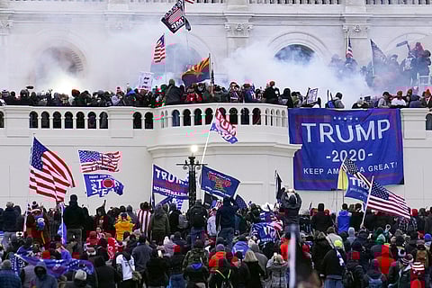 Rioters storm the West Front of the U.S. Capitol Jan. 6, 2021, in Washington.