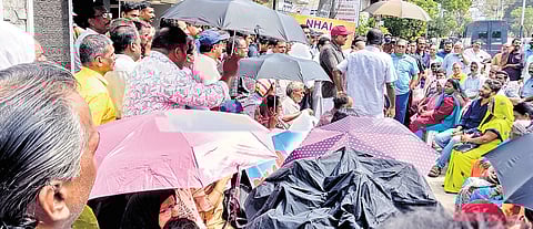 Landowners stage a protest in front of the office of the National Highway Authority of India at Pettah in Thiruvananthapuram on Tuesday