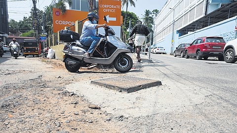 An elevated manhole on the busy Palayam-General Hospital stretch that has not been levelled with smart city project still going on
