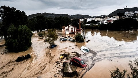 Cars are swept away by the water, after floods preceded by heavy rains caused the river to overflow its banks in the town of Alora, Malaga, Spain.