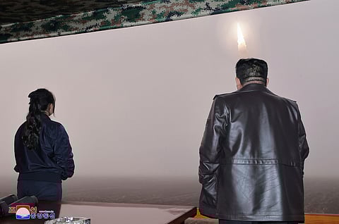 North Korean leader Kim Jong Un, right, and his daughter observe what it says a test launch of new intercontinental ballistic missile "Hwasong-19" at an undisclosed place,