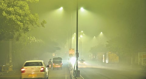 Smog engulfed streets in Korattur in Chennai after people burst crackers during Deepavali on Thursday night