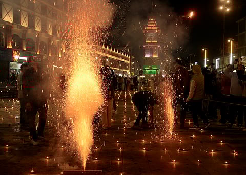 People burst firecrackers during the Diwali festival celebrations at Lal Chowk, in Srinagar, Thursday night, Oct. 31, 2024. Image used for representative purposes