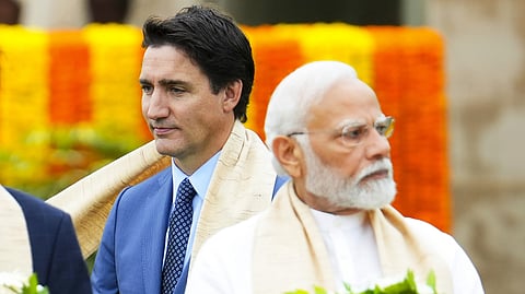 Prime Minister Narendra Modi with his Canadian counterpart Justin Trudeau as they take part in a wreath-laying ceremony at Raj Ghat during the G20 Summit in New Delhi in September 2023.