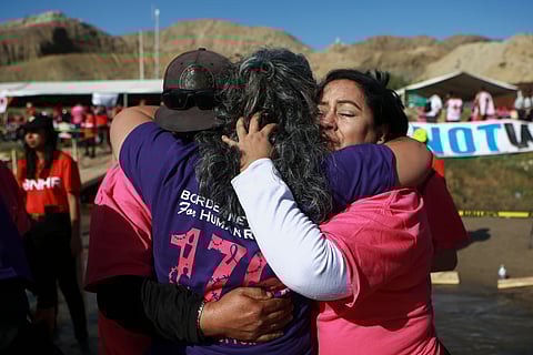 People living in Mexico meet with relatives living in the U.S., during the annual "Hugs not Walls" event on a stretch of the Rio Grande, in Ciudad Juarez, Mexico.