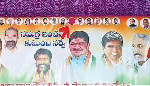 MLA M Sanjay Kumar’s photo is seen covered with a red sticker on a banner put up for a meeting on caste census in Jagtial on Sunday