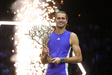 Germany's Alexander Zverev holds the trophy after winning the final of the Paris Masters tennis tournament at the Accor Arena on Sunday, Nov. 3, 2024, in Paris.