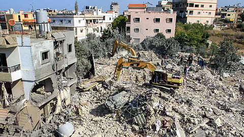 An excavator clears rubble and debris at the site of an overnight Israeli air strike on town of Sarafand, between Sidon and Tyre in southern Lebanon, on October 30, 2024.