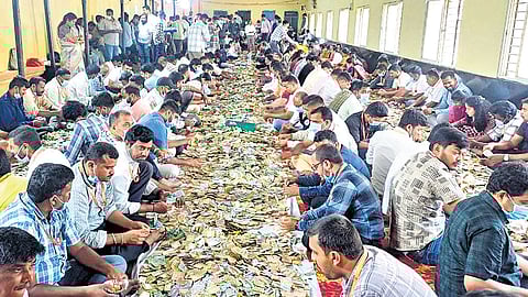 Revenue and Bank officials and volunteers count the hundi collection of Hasanamba and Siddeshwara temples in Hassan on Monday