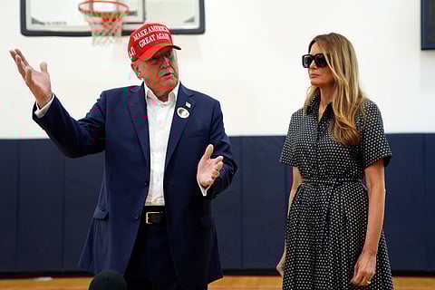 Republican presidential nominee former President Donald Trump and former first lady Melania Trump after voting on Election Day at the Morton and Barbara Mandel Recreation Center, Tuesday, Nov. 5, 2024, in Palm Beach, Fla.