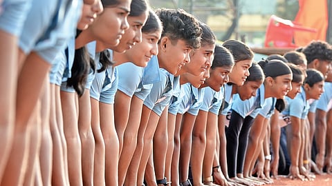 Students of Ideal HSS Kadakassery, Thavanur, Malappuram, prepare to train at the Maharaja’s College Stadium