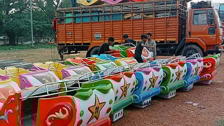 Workers arranging joyrides at Balijatra ground in Cuttack