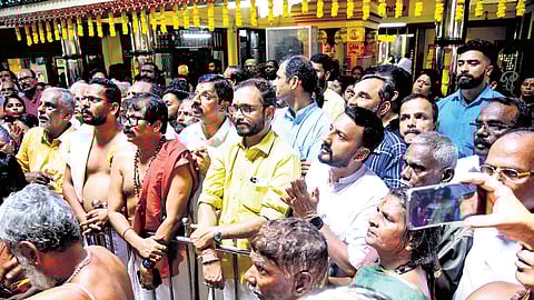 Bypoll candidates Rahul Mamkootathil (Congress), C Krishnakumar (BJP) and P Sarin (CPM), attend the flag hoisting ceremony of Kalpathy chariot festival in Palakkad on Thursday. BJP state president K Surendran is also seen