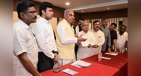 BJP Fact Finding Committee head Govind Karjol submitting the report to JPC chairman Jagadambika Pal in Hubballi on Thursday