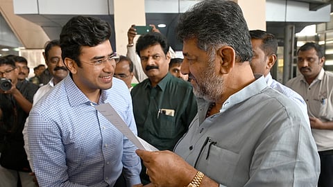 Deputy CM DK Shivakumar (R) with MP Tejasvi Surya.