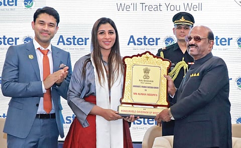 West Bengal Governor C V Ananda Bose handing over the ‘Pravasi Bhushan’ award to Alisha Moopen, deputy managing director, Aster DM Healthcare, on Friday