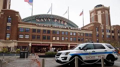 A patrol car sits outside the Navy Pier as police investigate the scene of a shooting on Tuesday, Nov. 5, 2024.