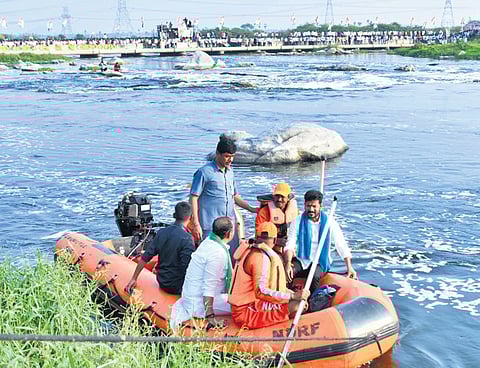 Chief Minister A Revanth Reddy takes a closer look at the polluted water of the River Musi at Sangem in Yadadri Bhuvanagiri district on Friday