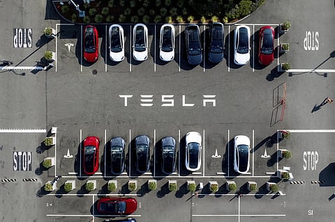 Tesla vehicles line a parking lot at the company’s Fremont, Calif., factory, on Sept. 18, 2023.