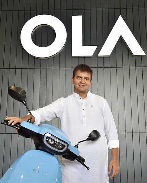 Bengaluru: Ola founder and CEO Bhavish Aggarwal poses with OLA E-Scooter at a launch press conference in Bengaluru.